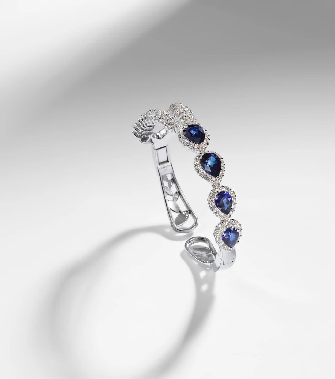 Yeprem - Reign Supreme 18kt white gold bangle with sapphires and diamonds