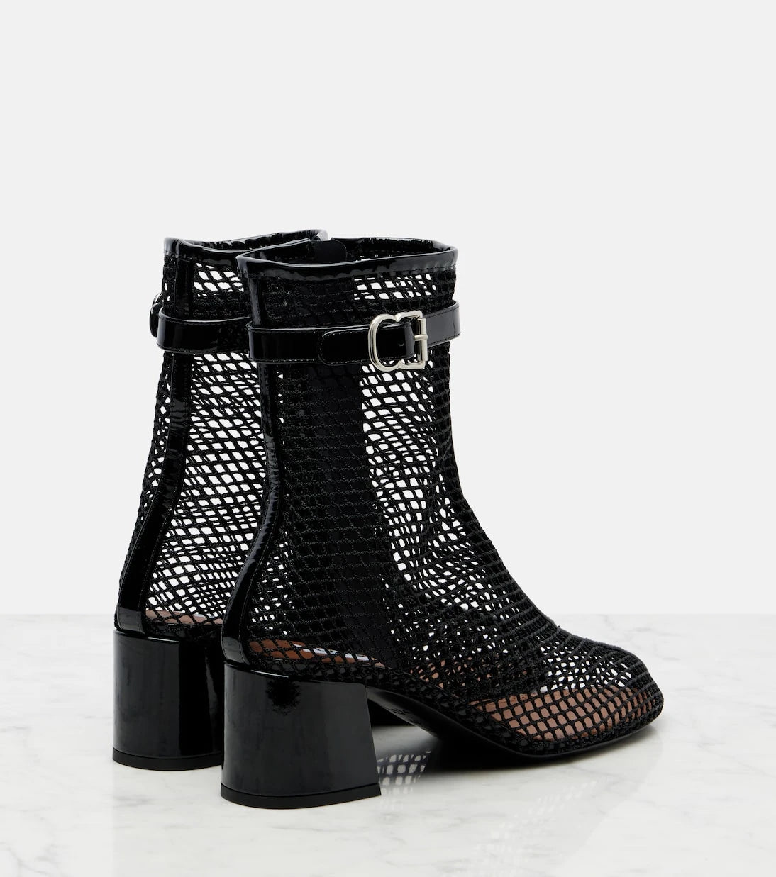Alaïa - Fishnet patent leather-trimmed ankle boots
