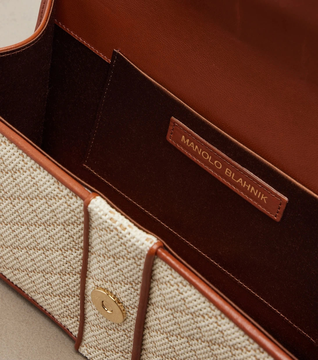 Manolo Blahnik - Maycap raffia-effect clutch