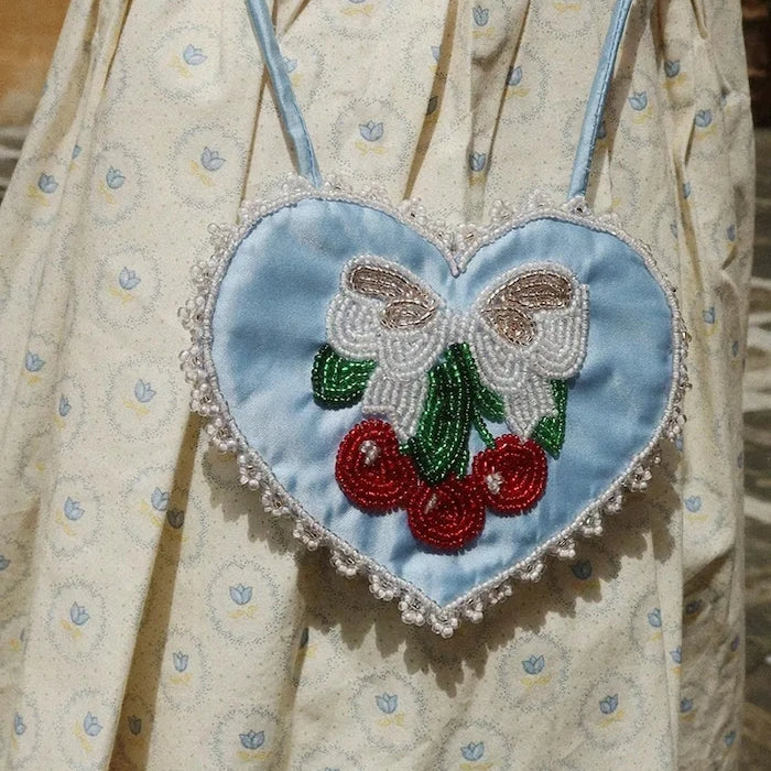 Konges Sløjd чанта crossbody за деца BEADED HEART MINI PURSE