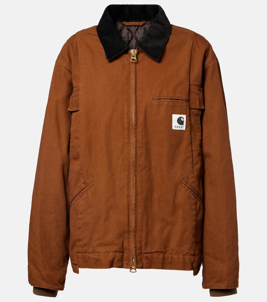 Sacai - جاكيت بافر من قماش الكانفاس القطني بتعاون مع Carhartt