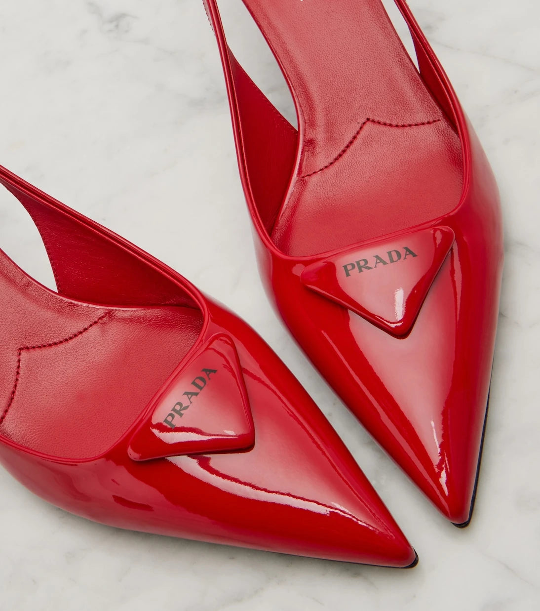 Prada - 55 patent leather slingback pumps