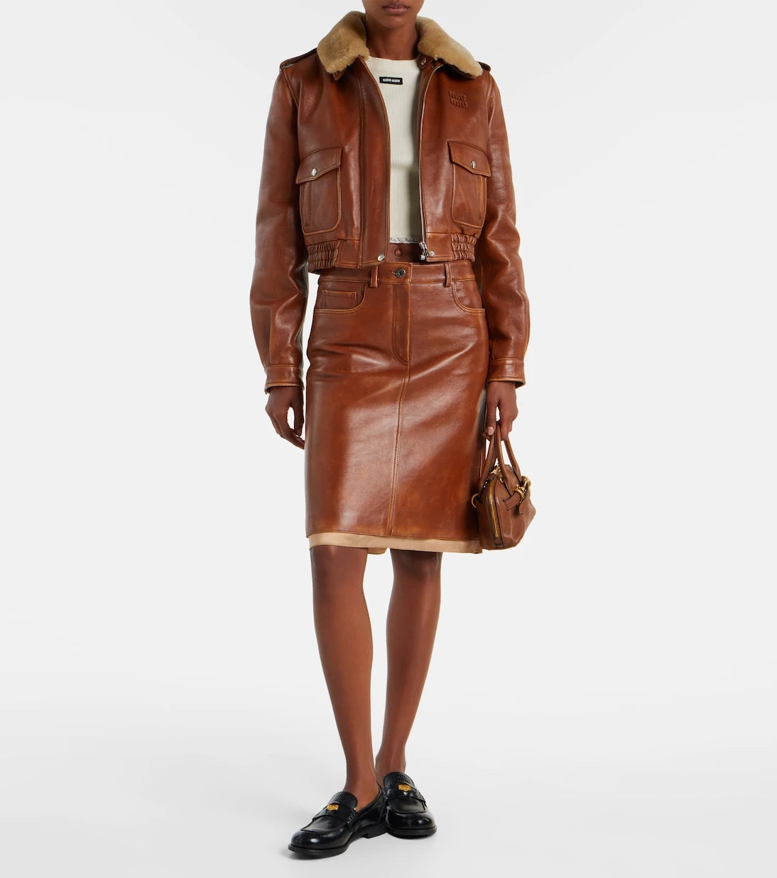 Miu Miu - تنورة جلدية متوسطة الطول