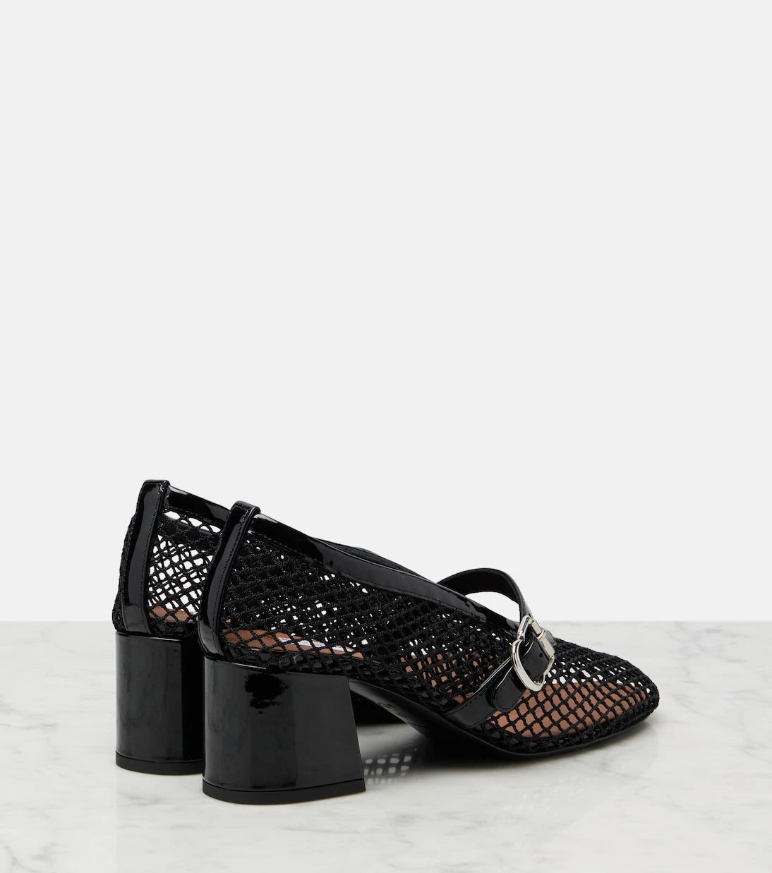 Alaïa - Fishnet leather-trimmed Mary Jane pumps