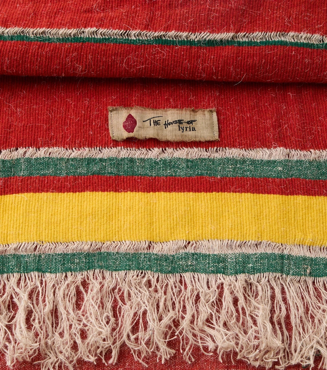 The House of Lyria - Xoroi striped wool-blend throw