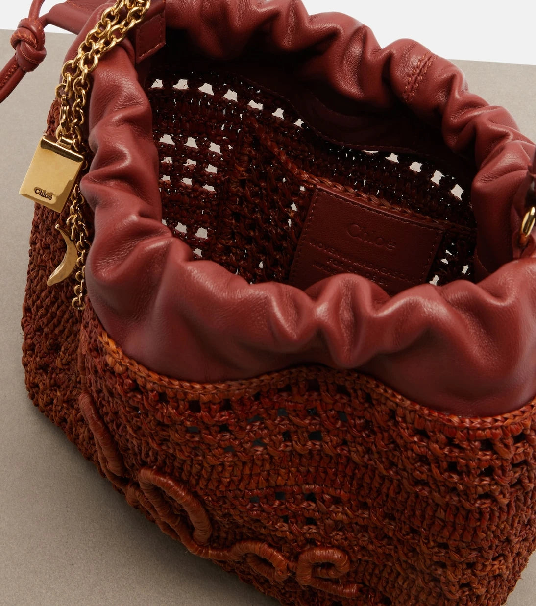Chloé - Mini leather-trimmed raffia bucket bag