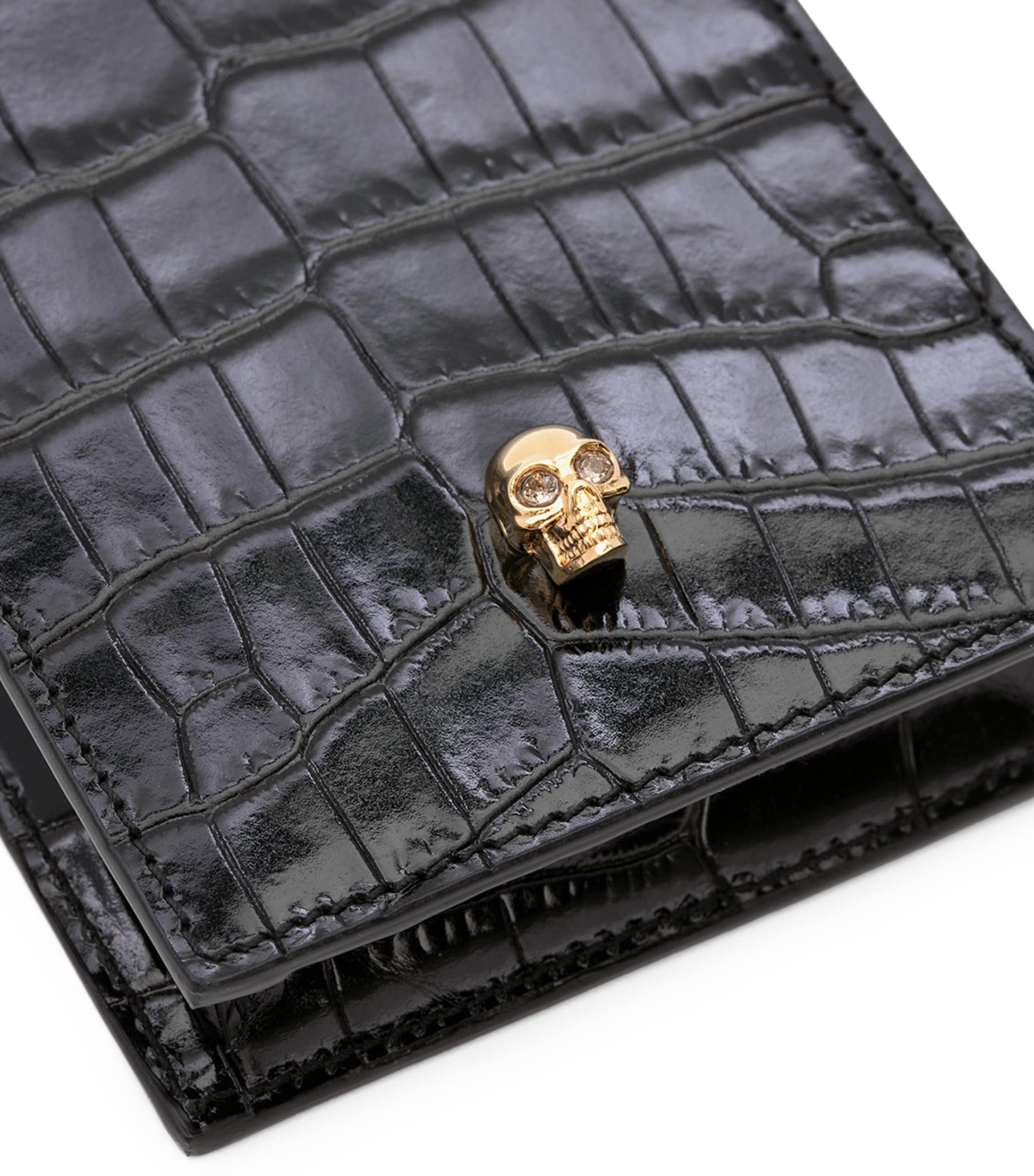 McQueen Skull-embellished croc-embossed leather phone case