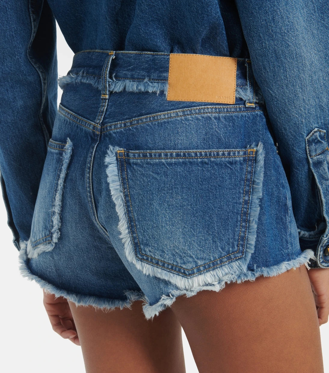 Alanui - Fringed denim shorts
