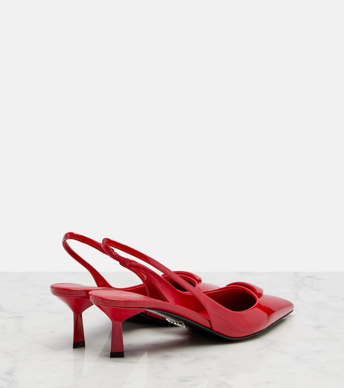 Prada - 55 patent leather slingback pumps