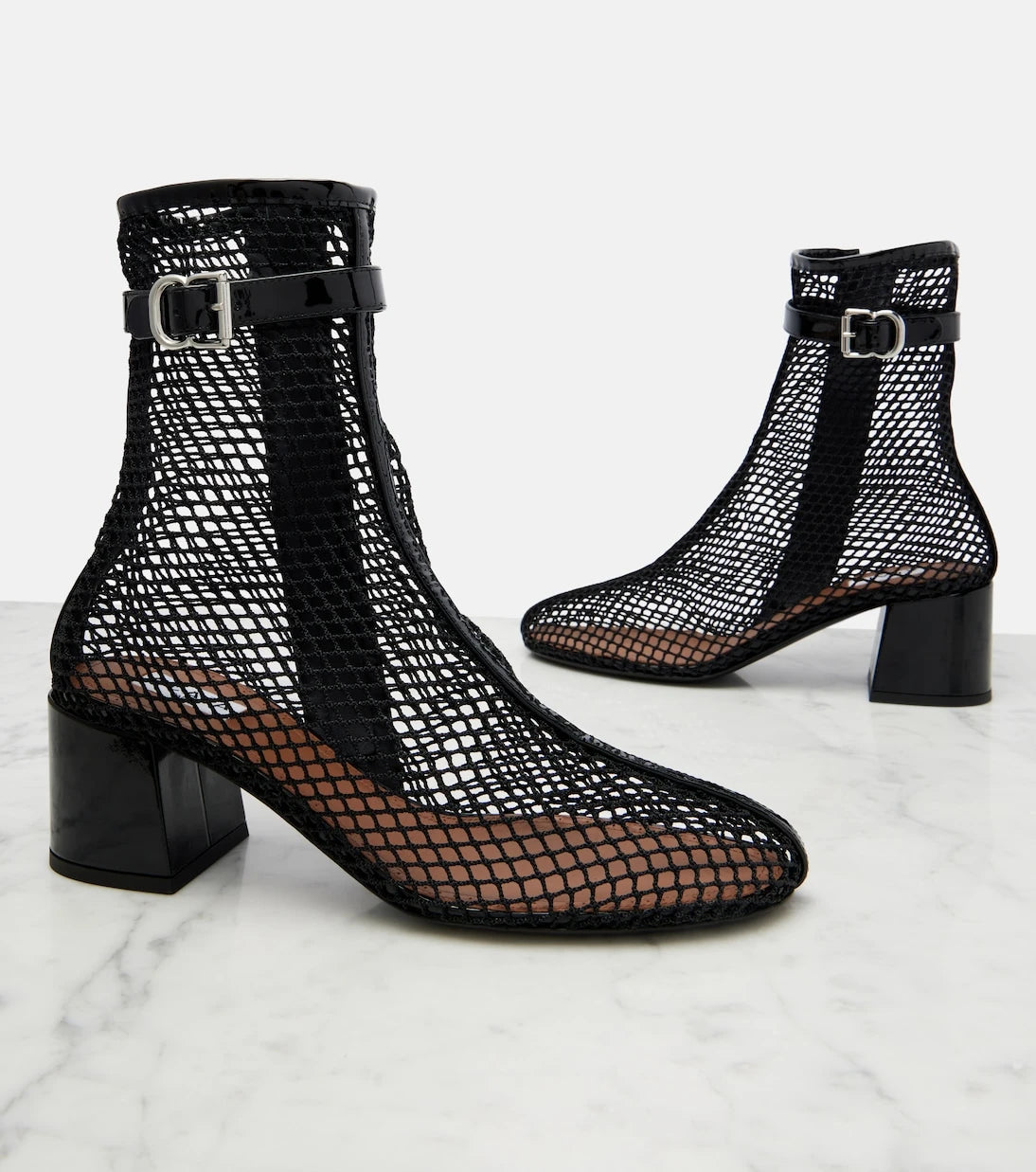 Alaïa - Fishnet patent leather-trimmed ankle boots