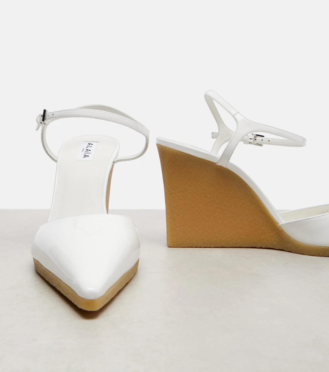 Alaïa - 90 patent leather wedge slingback pumps