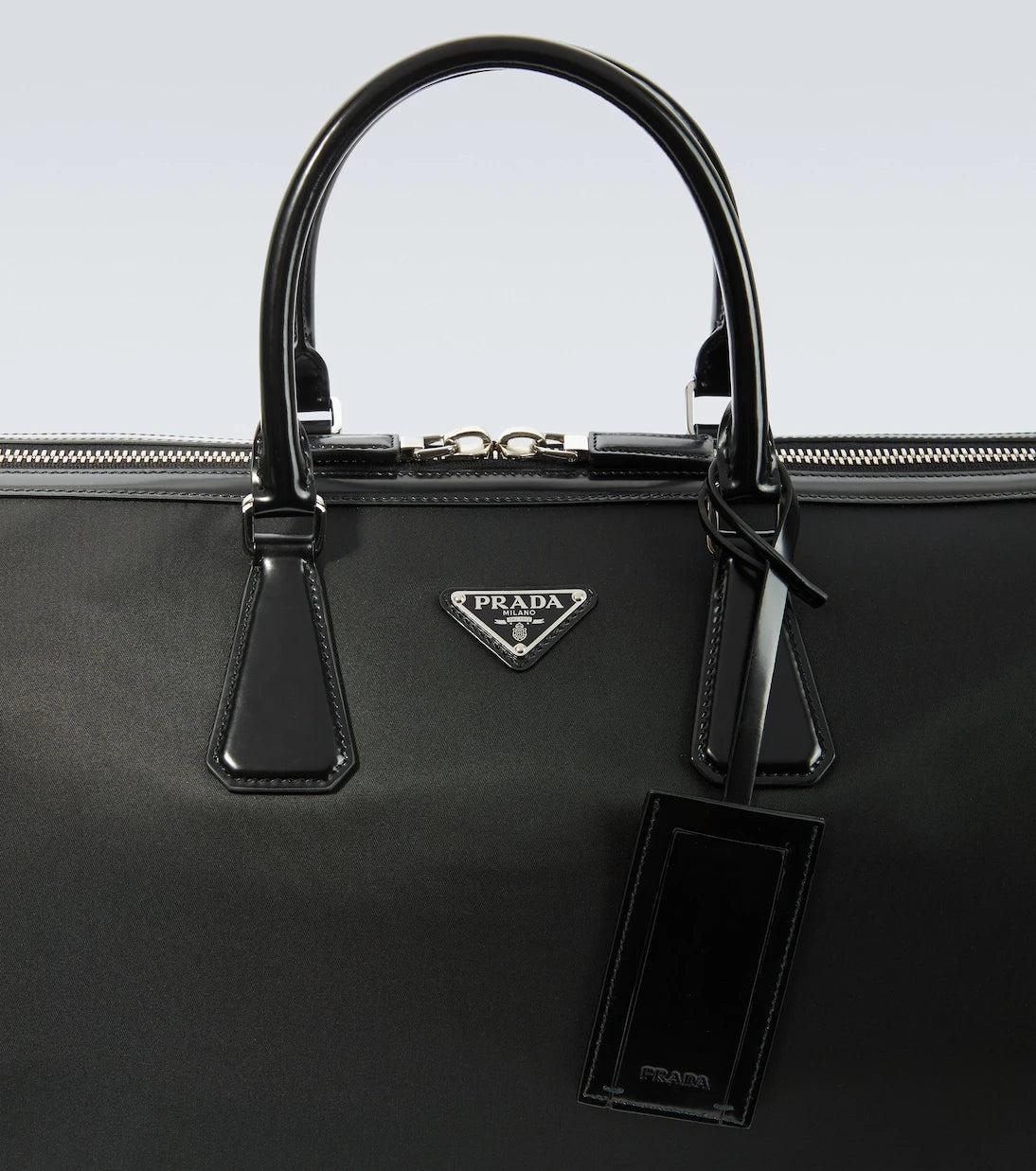 Prada - Leather-trimmed duffel bag