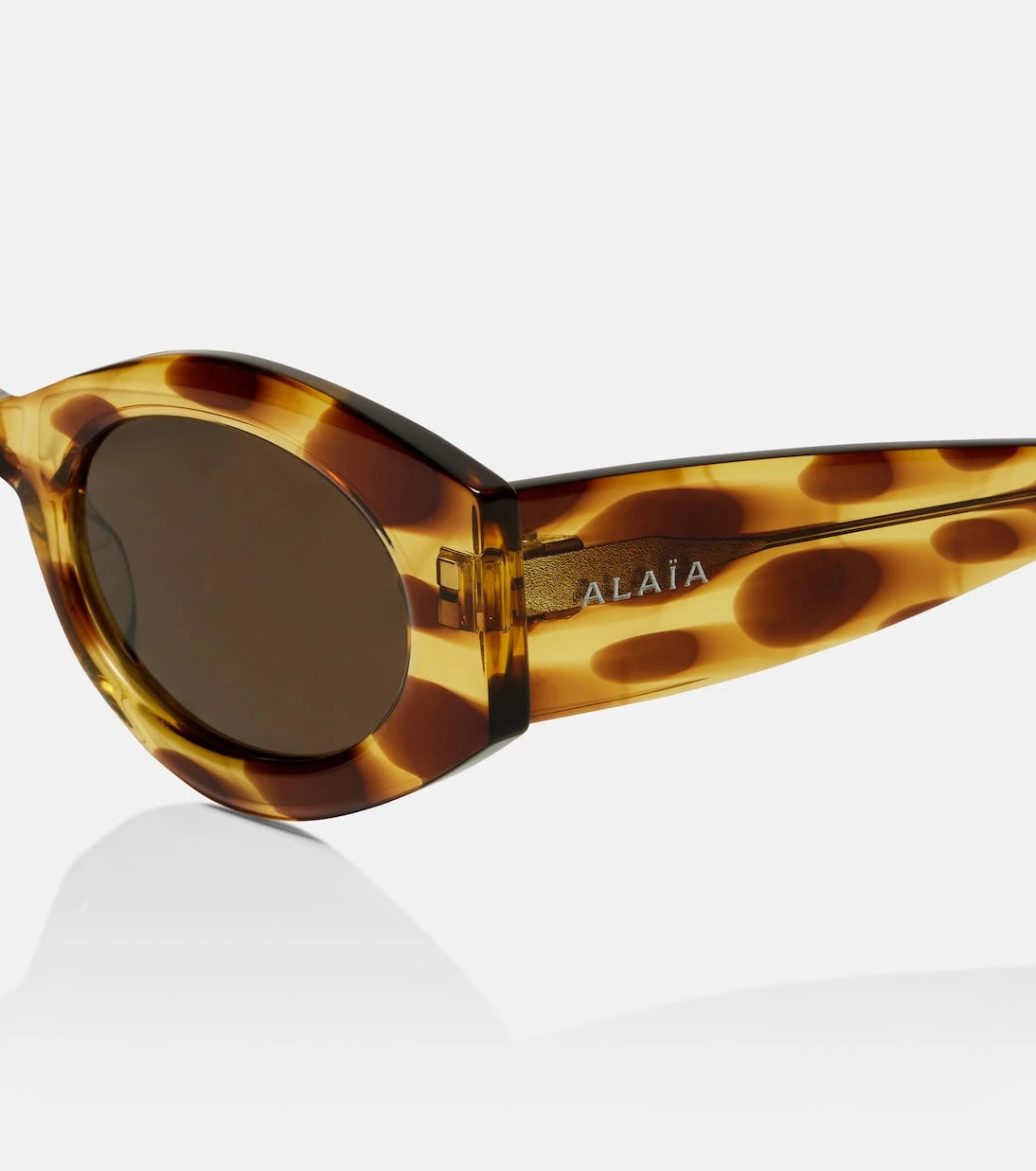 Alaïa - نظارة شمسية بيضاوية بشعار