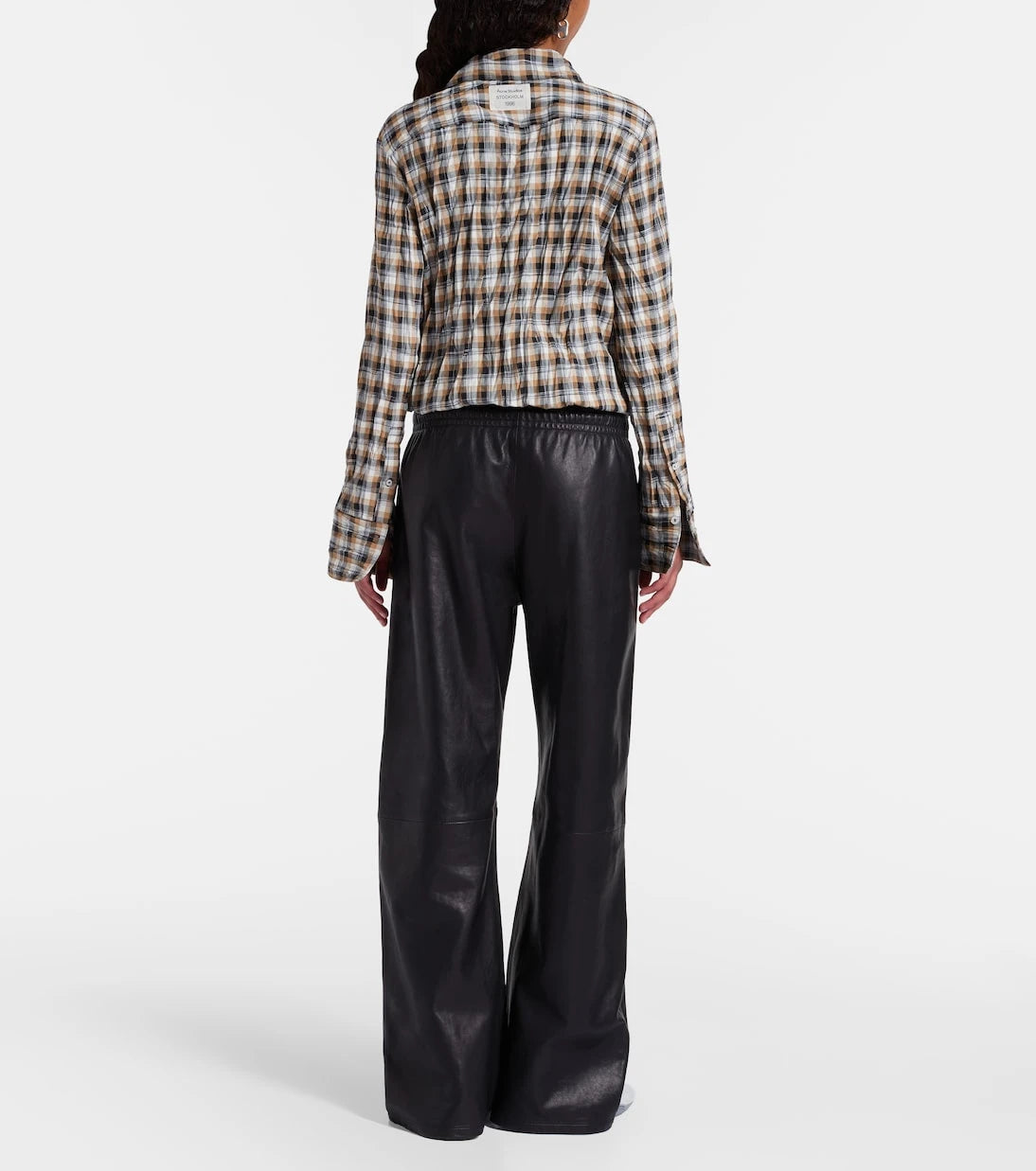 Acne Studios - بنطال جلدي واسع الساقين
