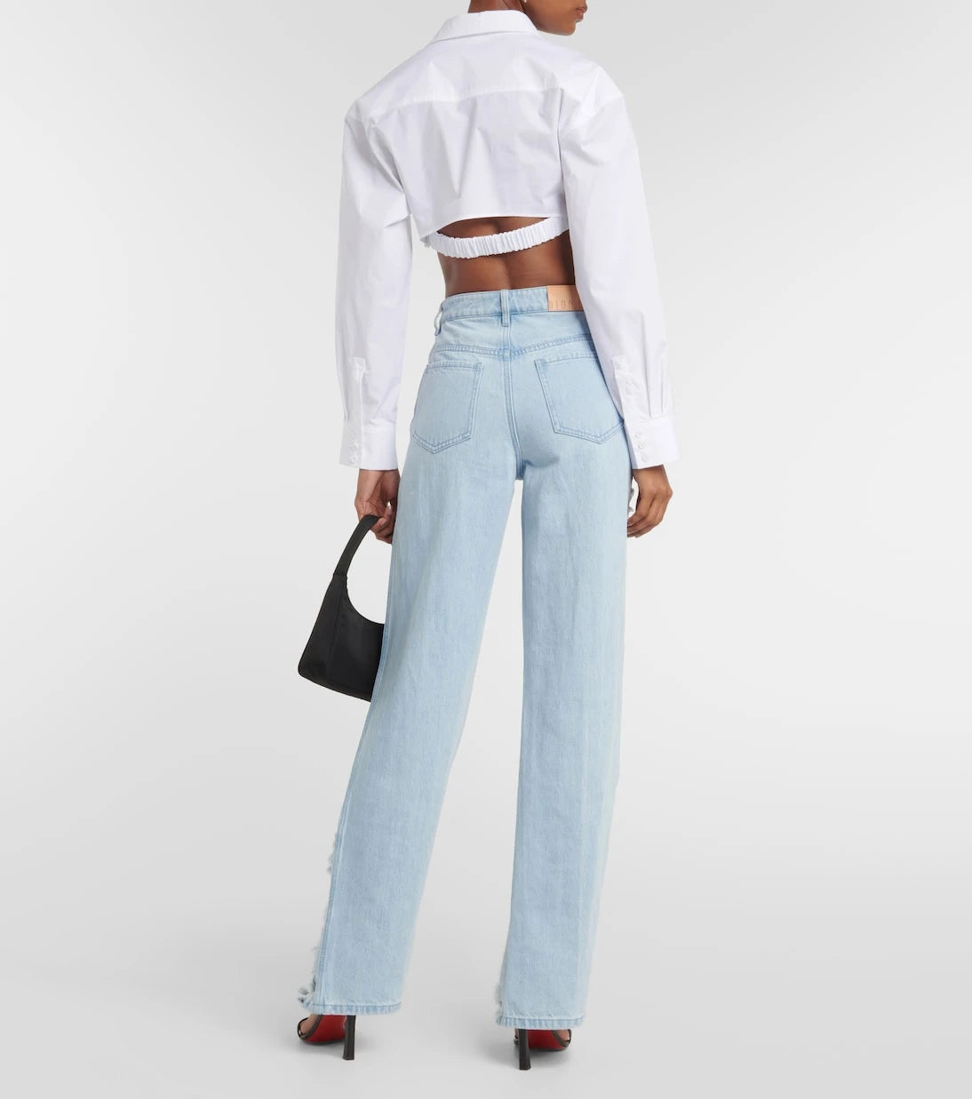 Dion Lee - بنطلون جينز واسع الساق بقصة منخفضة ممزق