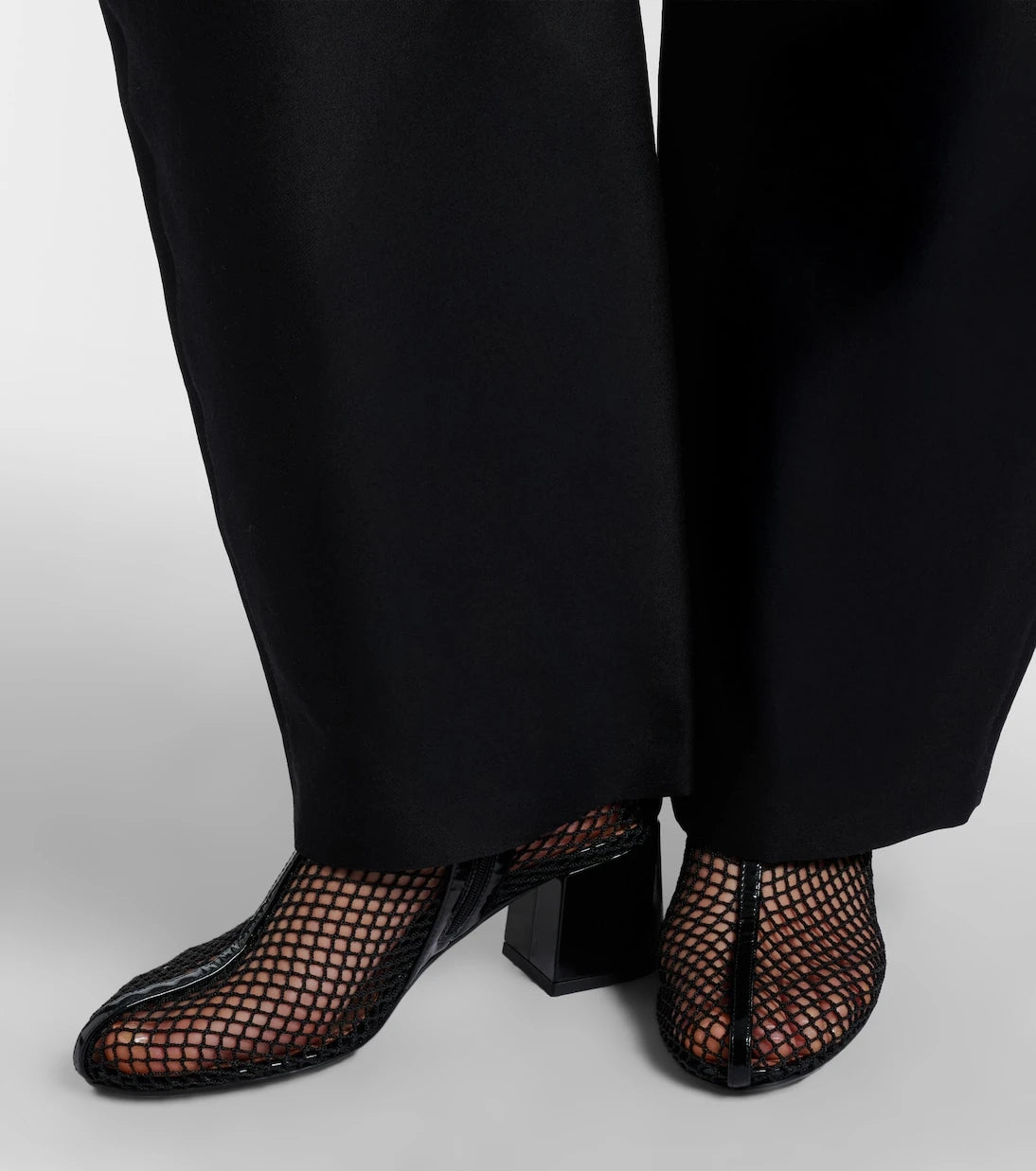 Alaïa - Fishnet patent leather-trimmed ankle boots