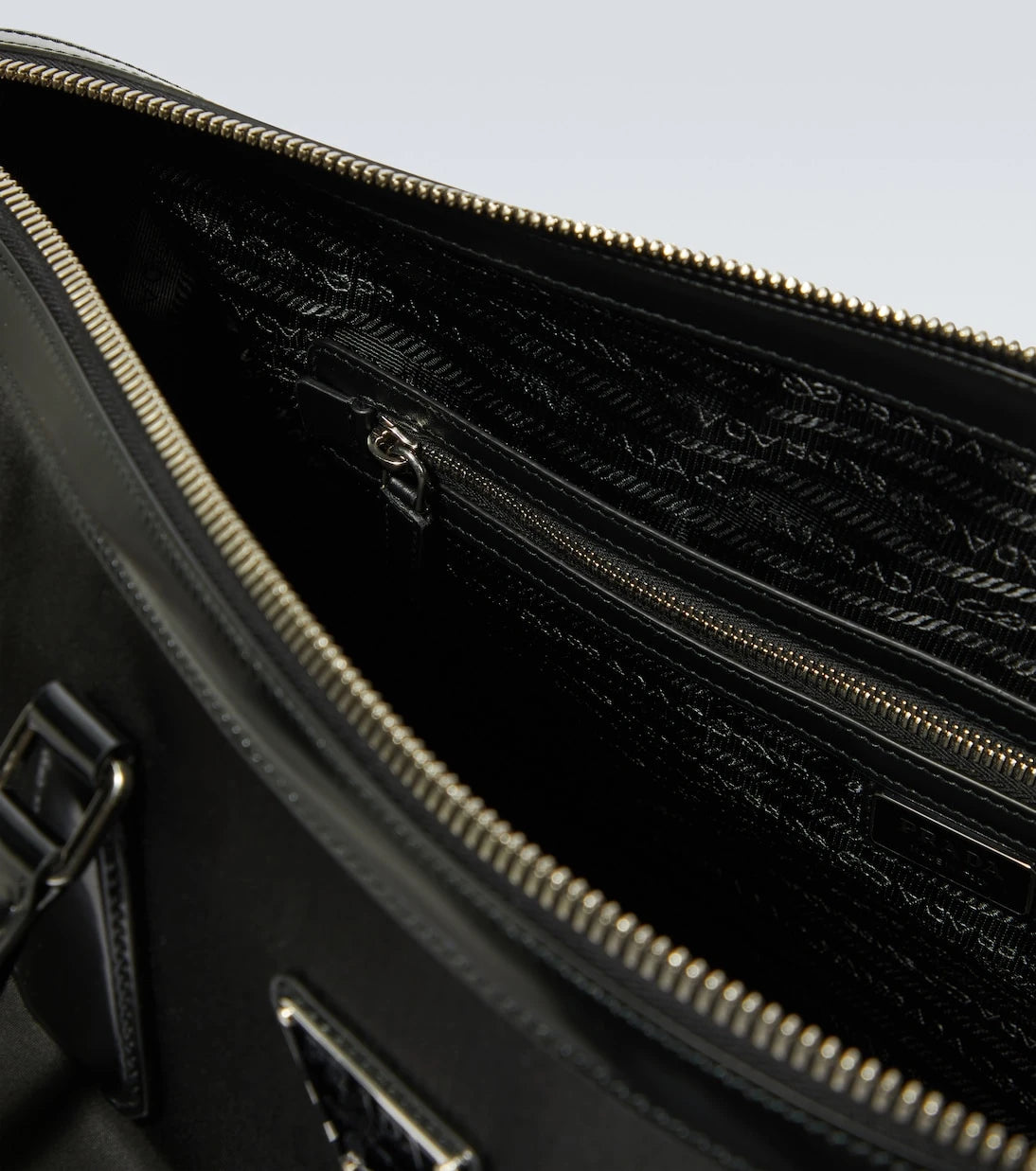 Prada - Leather-trimmed duffel bag