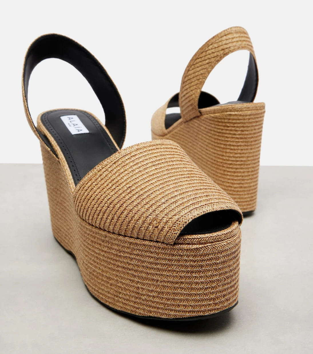 Alaïa - Straw wedge sandals