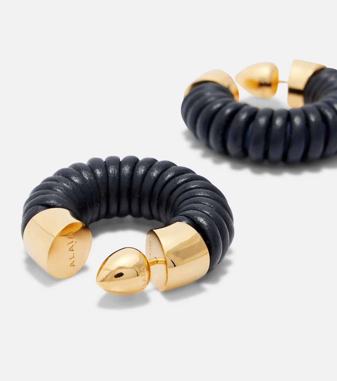 Alaïa - Bobine leather-trimmed hoop earrings