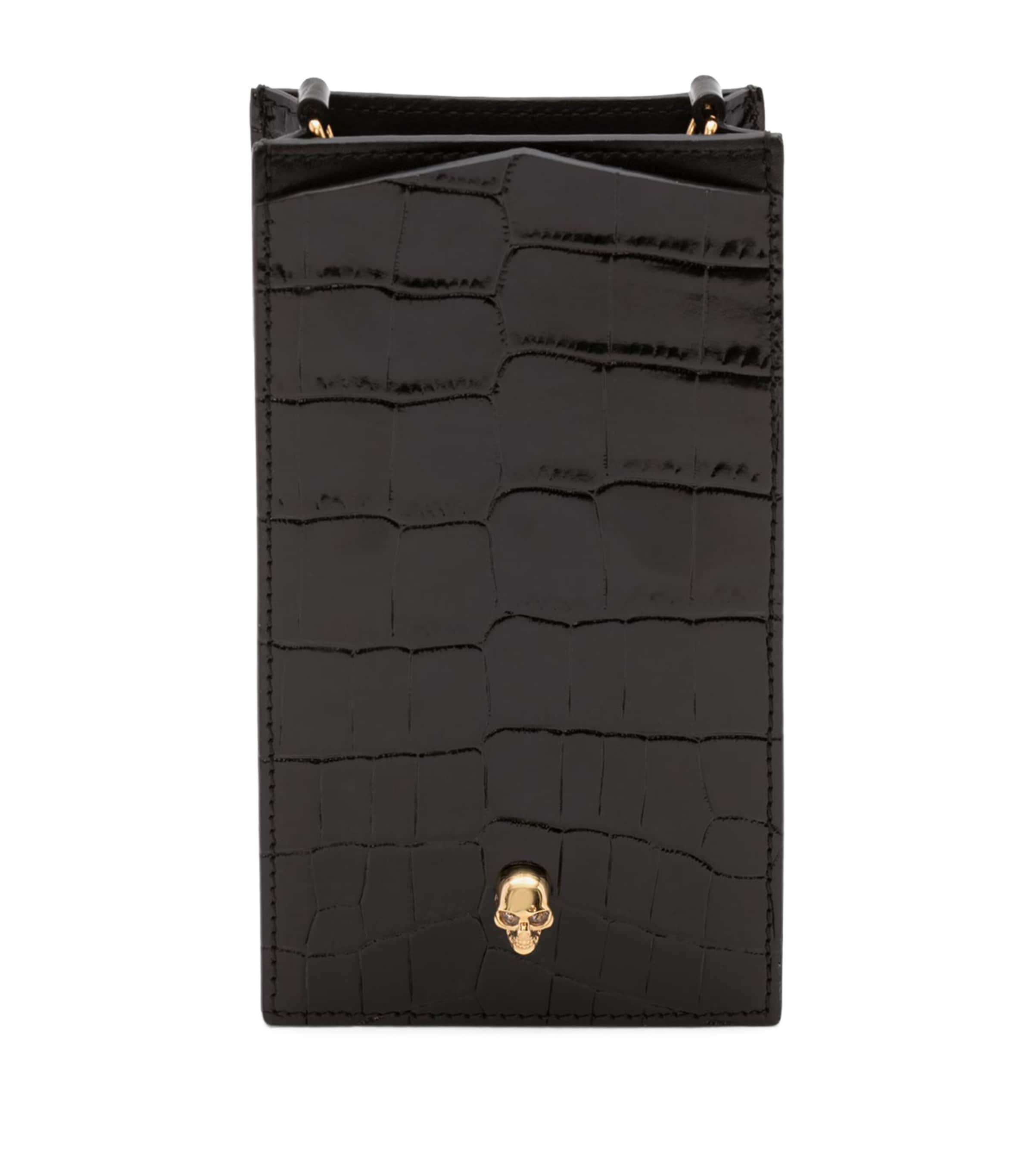 McQueen Skull-embellished croc-embossed leather phone case