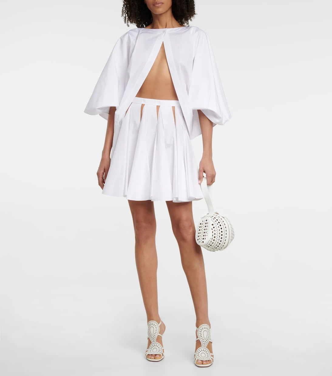 Alaïa - High-rise cutout cotton miniskirt