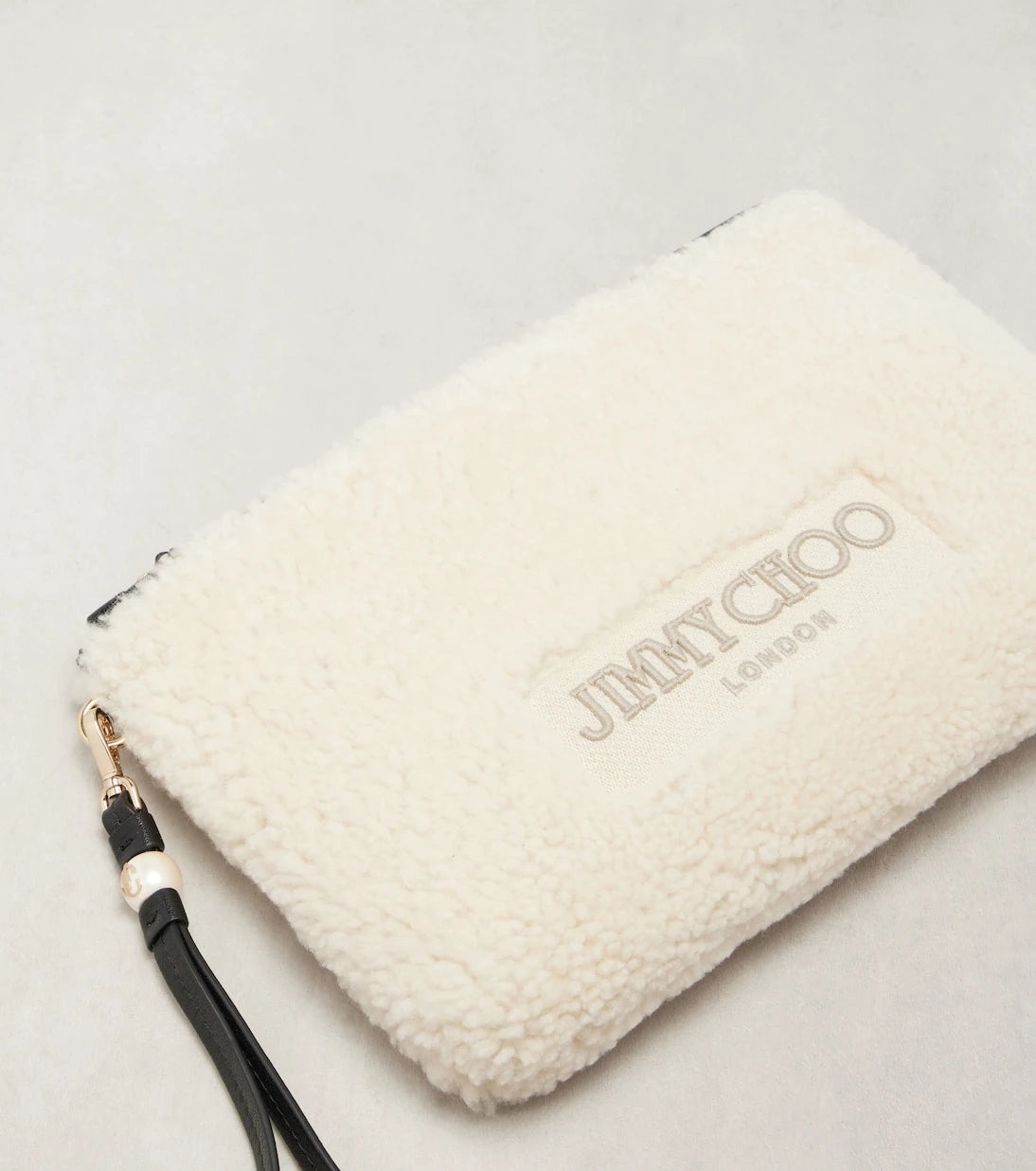 Jimmy Choo - Logo shearling pouch with strap