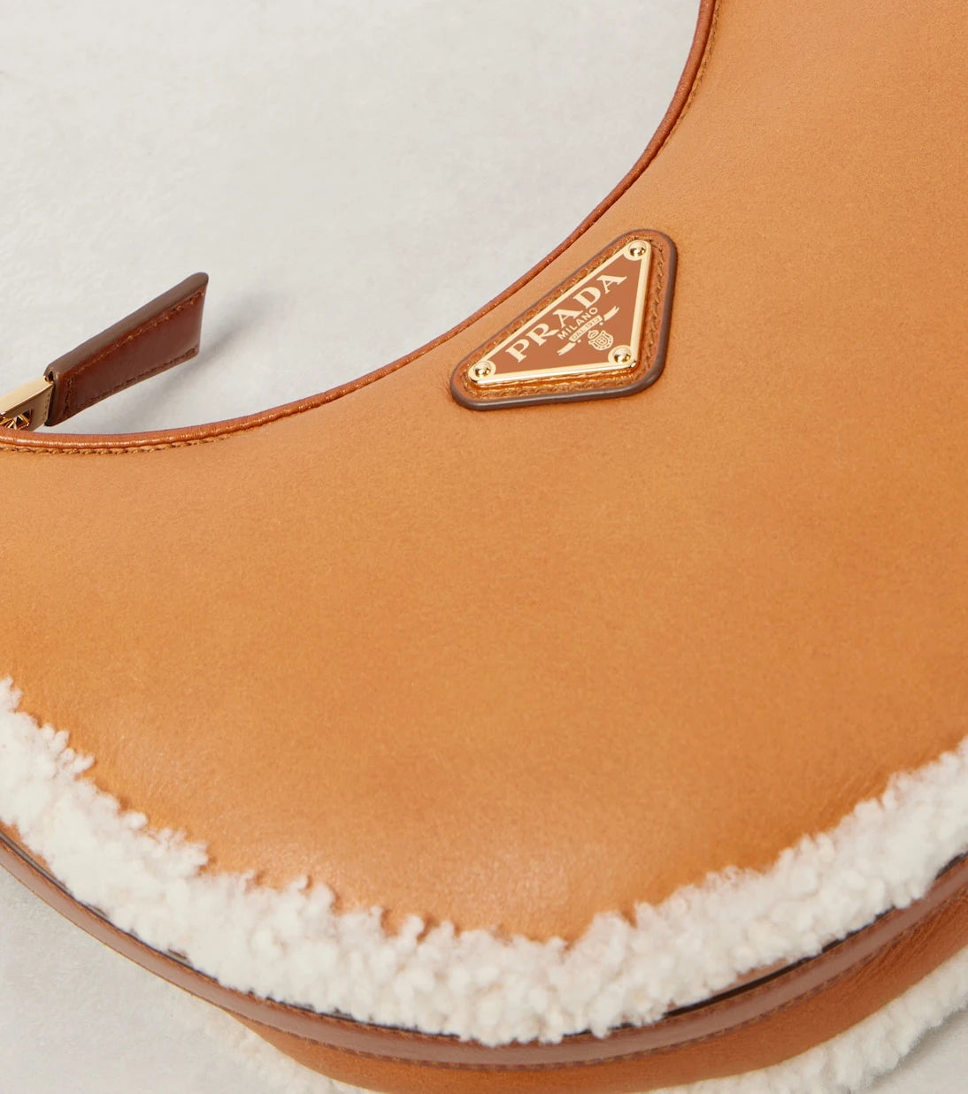 Prada - Arqué Small shearling-trimmed leather shoulder bag