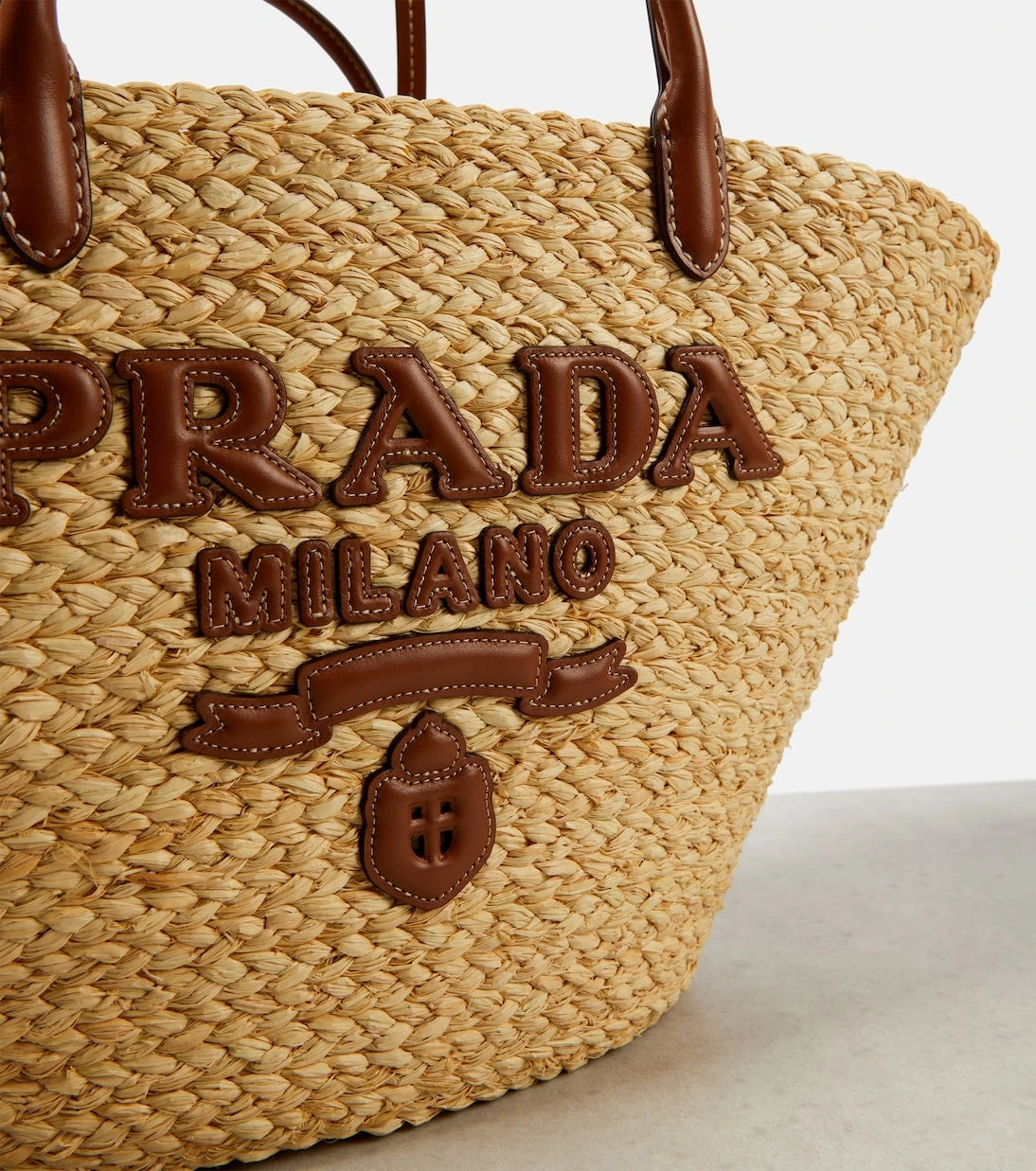 Prada - Logo leather-trimmed raffia basket bag