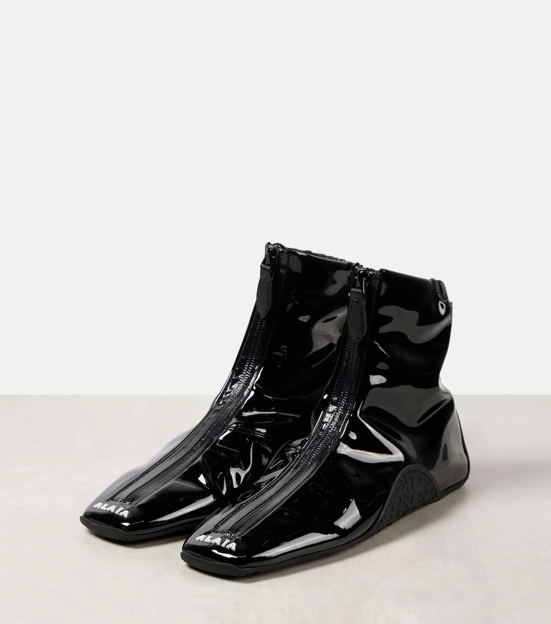 Alaïa - Sneaker faux patent leather ankle boots