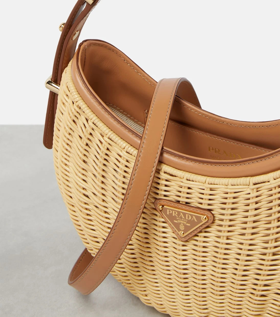 Prada - Arqué woven leather-trimmed shoulder bag