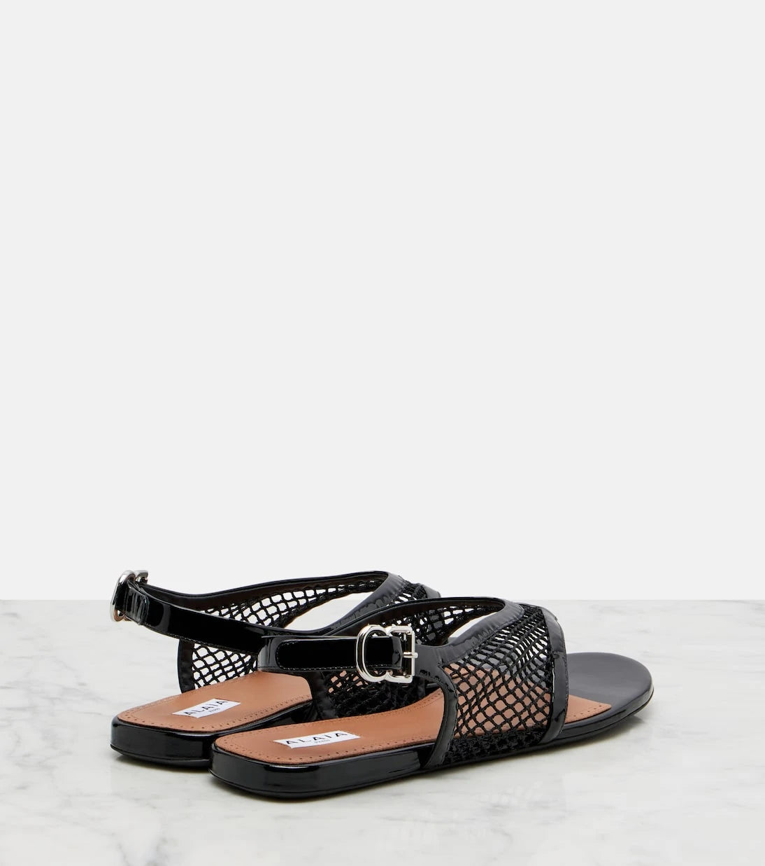 Alaïa - Fishnet leather-trimmed thong sandals