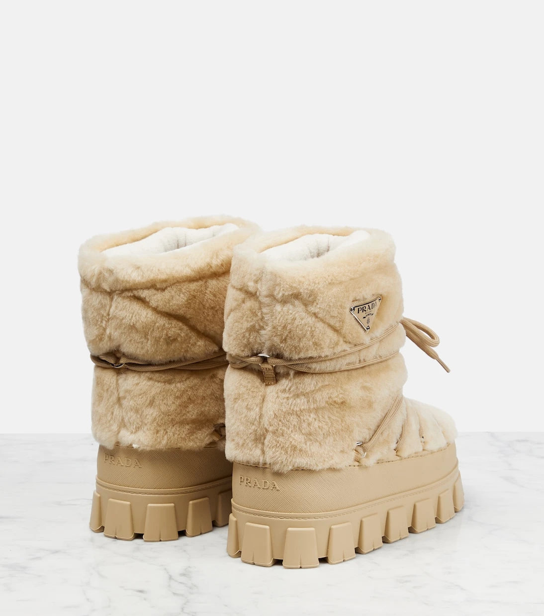 Prada - Shearling and leather snow boots