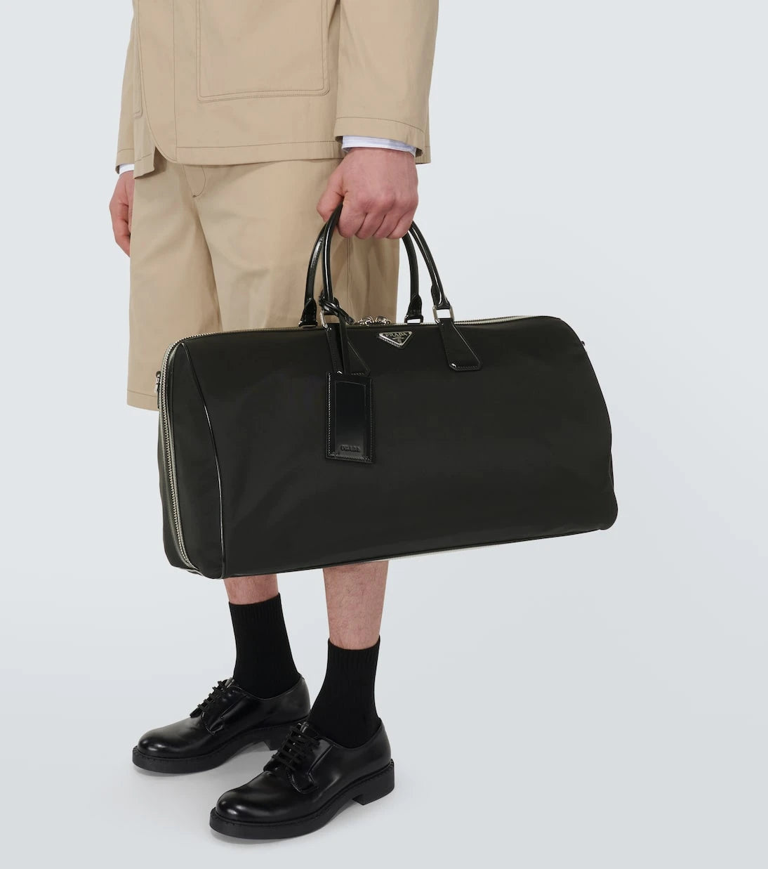 Prada - Leather-trimmed duffel bag