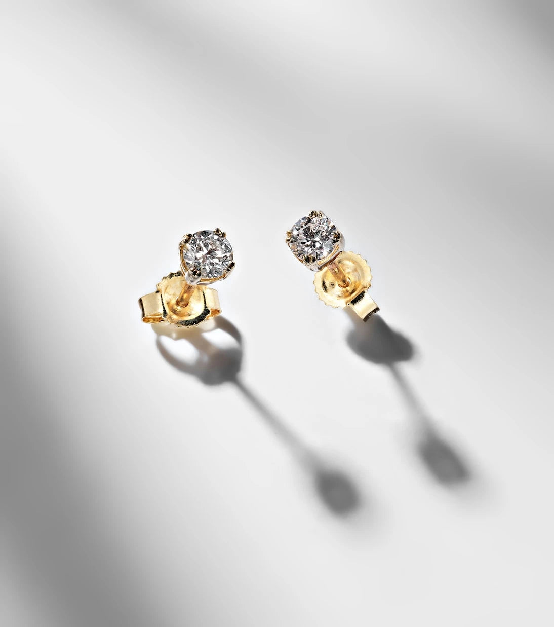 Stone and Strand - 14kt gold earrings with diamonds
