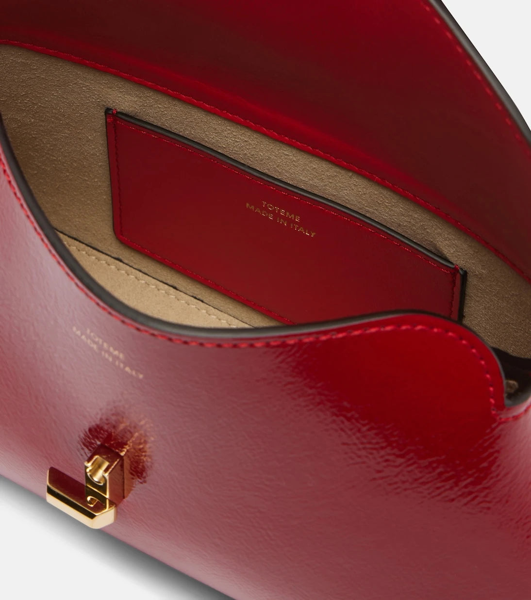 Toteme - T-Lock Mini patent leather clutch