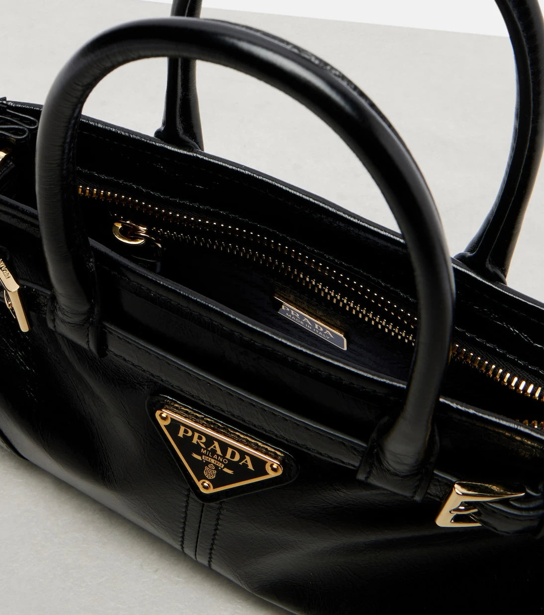 Prada - Prada Bonnie Mini leather top-handle bag