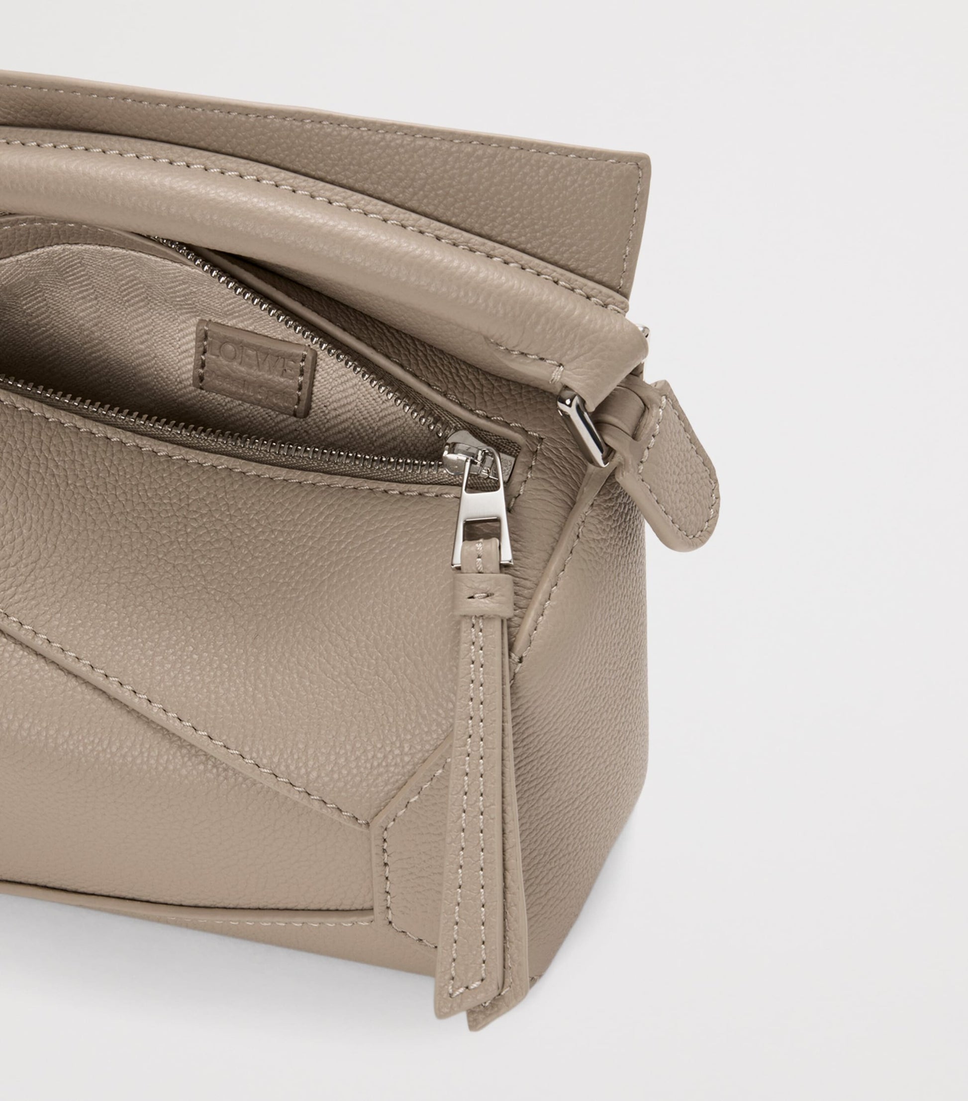 Mini Leather Puzzle Edge Top-Handle Bag