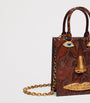Mini Etched-Leather Face Top-Handle Bag