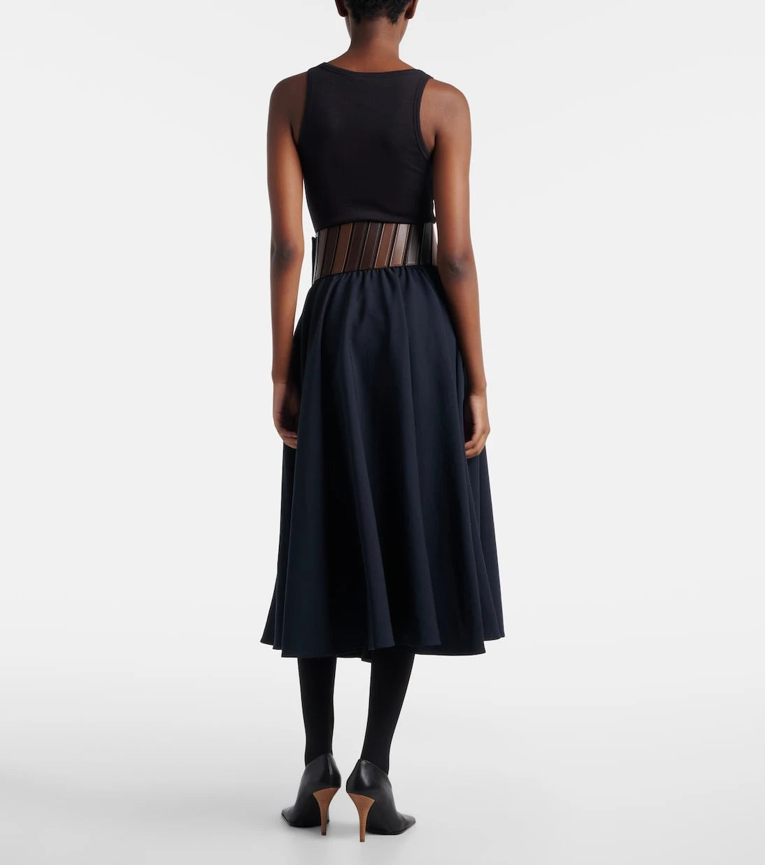 Alaïa - تنورة متوسطة الطول من الصوف بكسرات جلدية