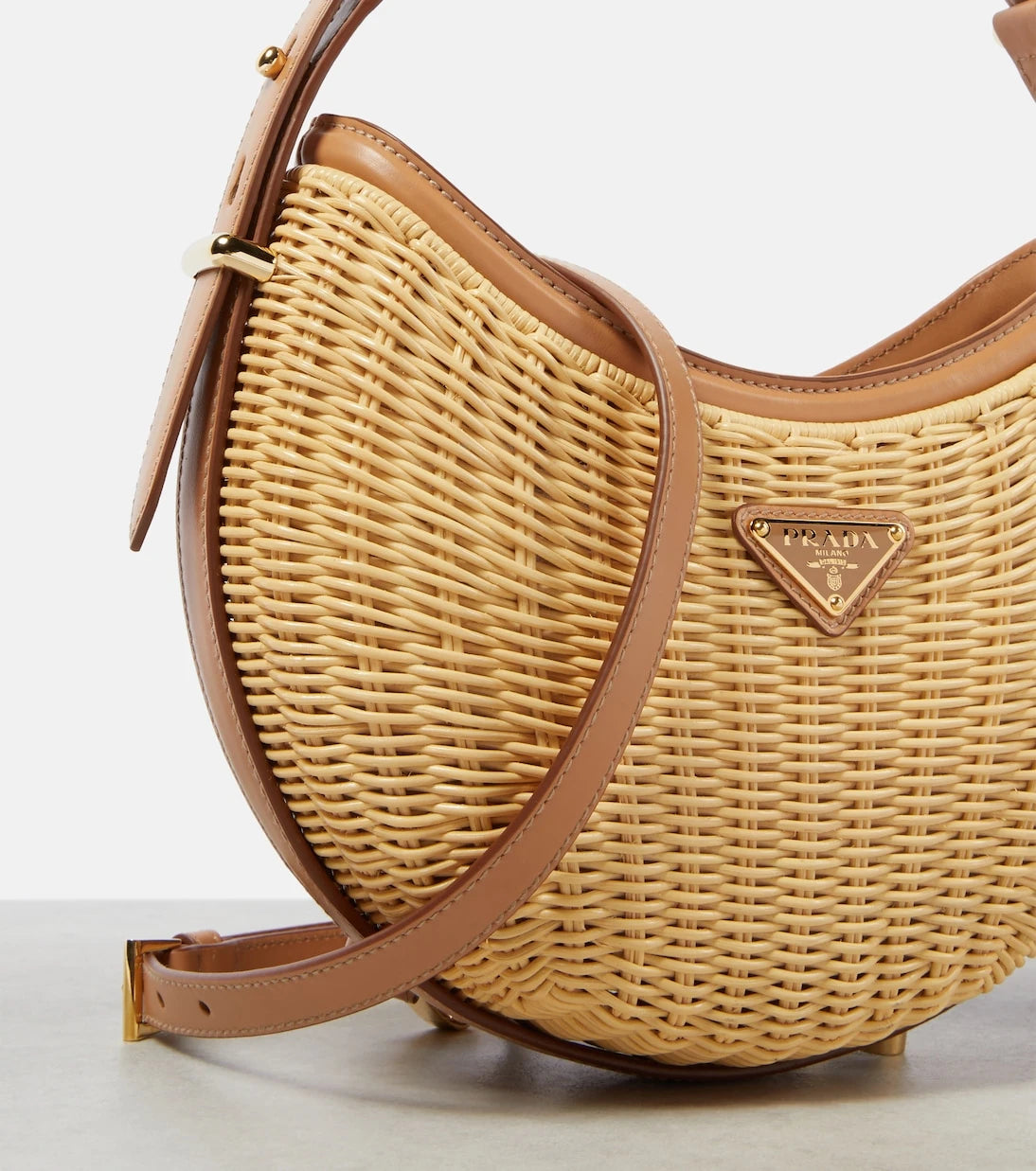 Prada - Arqué woven leather-trimmed shoulder bag