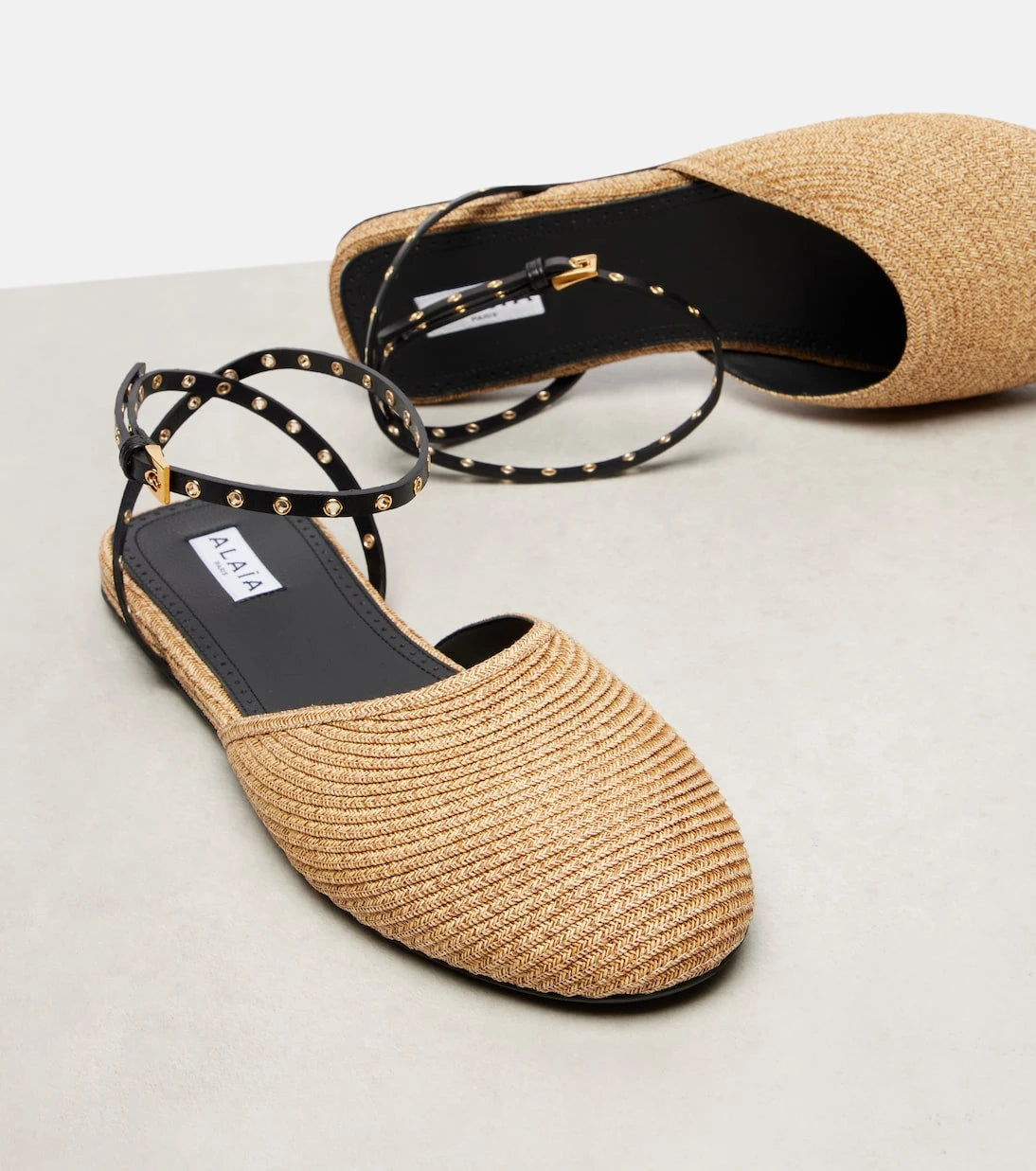 Alaïa - Leather-trimmed raffia flats