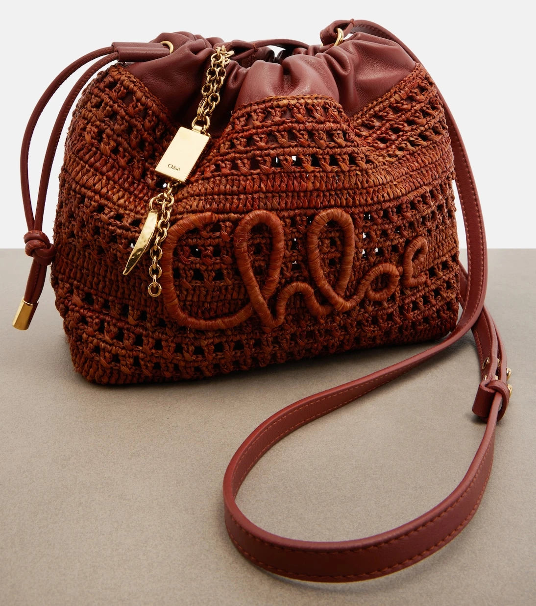 Chloé - Mini leather-trimmed raffia bucket bag