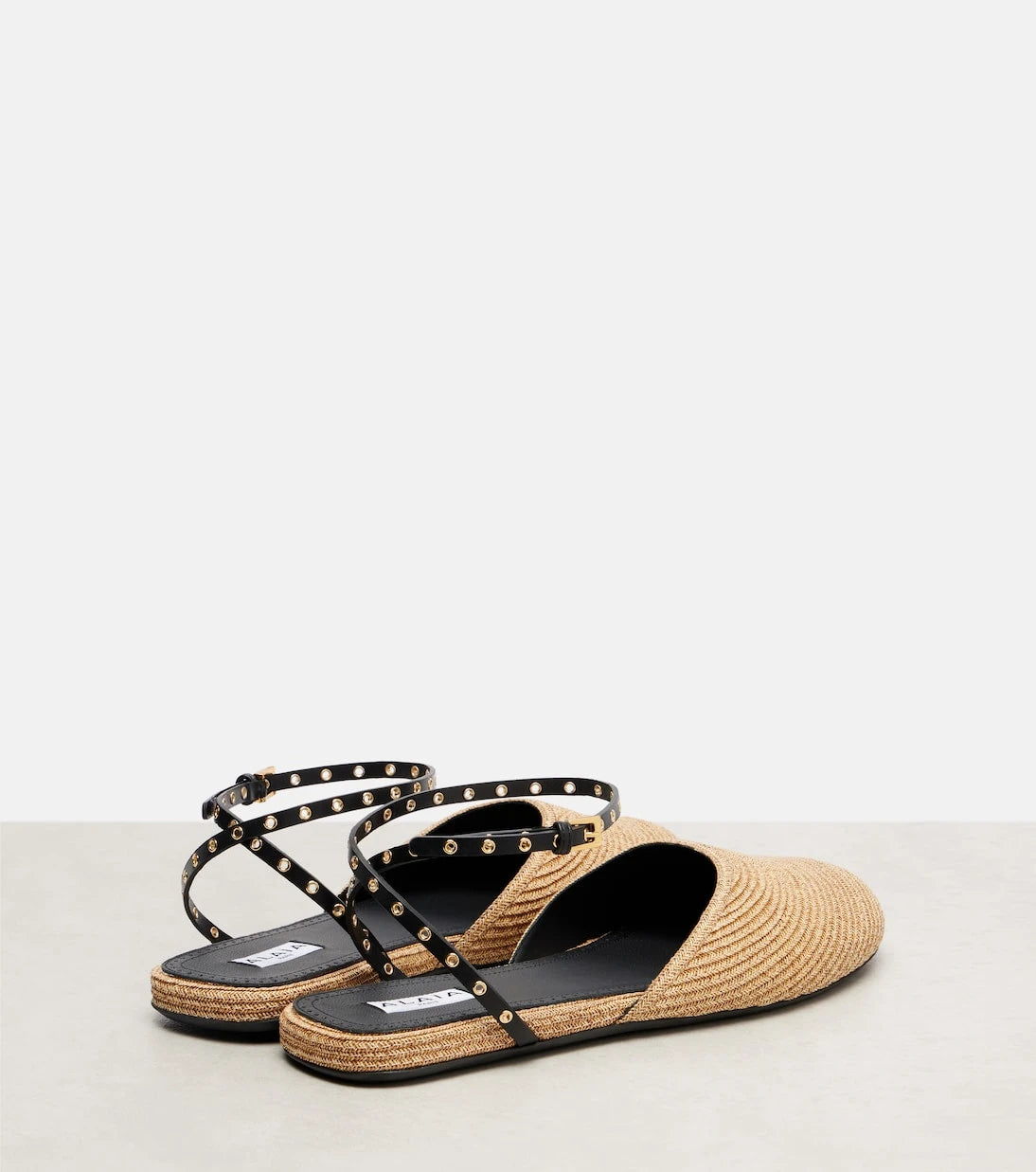 Alaïa - Leather-trimmed raffia flats