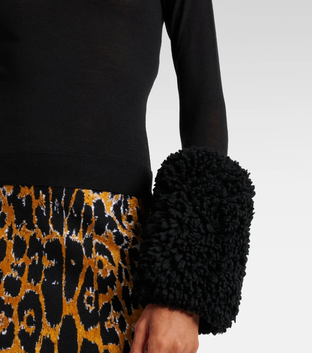 Alaïa - Faux fur-trimmed wool turtleneck top