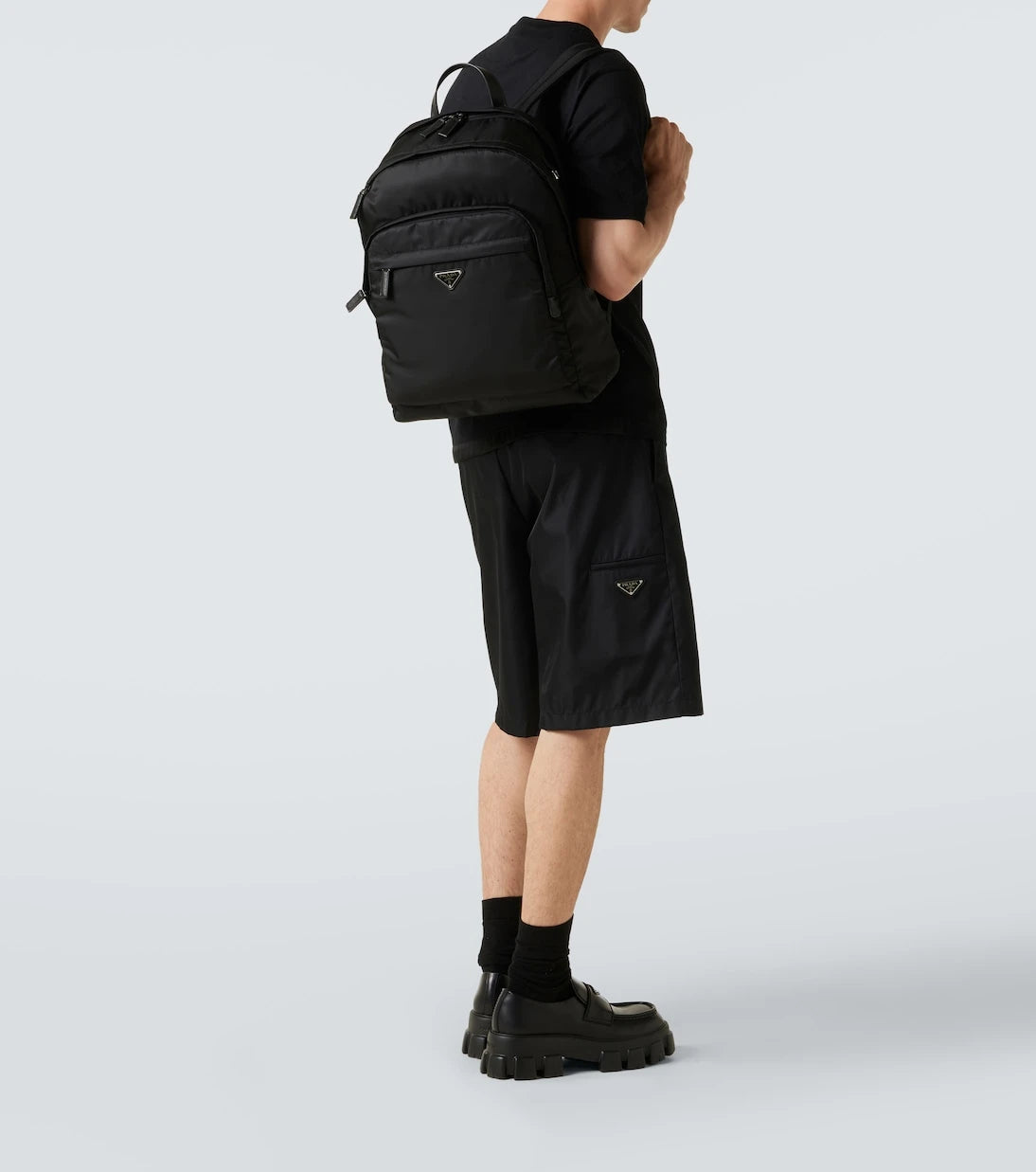 Prada - حقيبة ظهر Re-Nylon بحواف جلدية