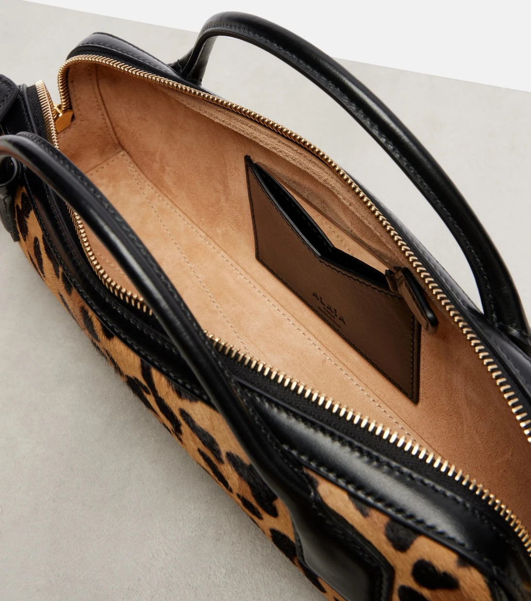Alaïa - Le Teckel leopard-print calf hair clutch
