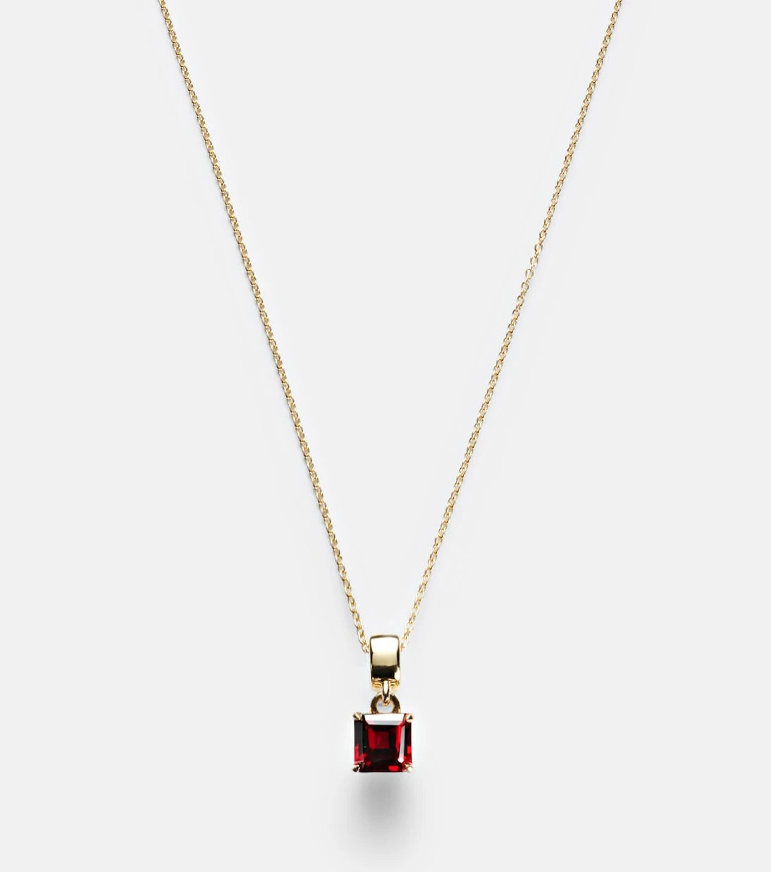 Stone and Strand - 10kt gold charm necklace with garnet