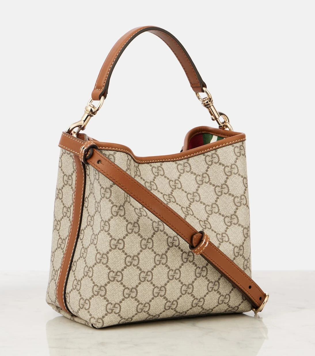 Gucci - حقيبة دلو صغيرة من الكانفاس بشعار GG