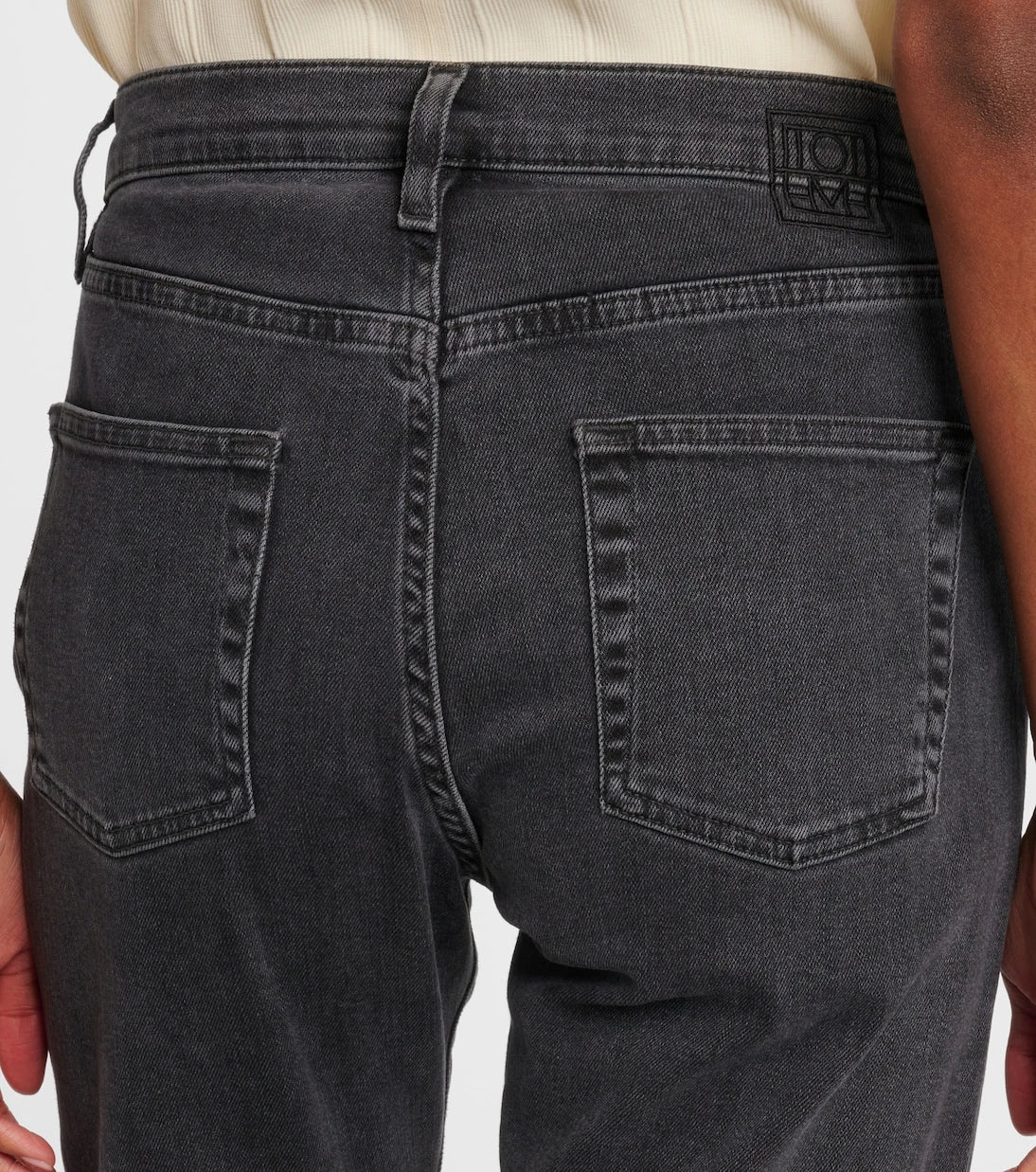 Toteme - Mid-rise twisted-seam straight jeans