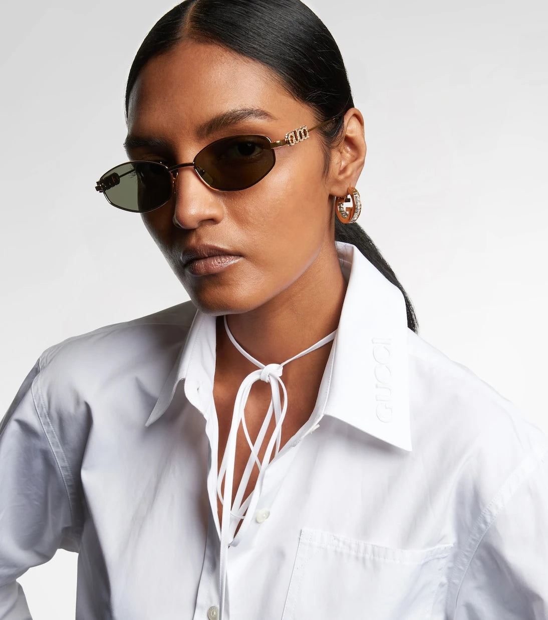 Gucci - نظارات شمسية بيضاوية مزينة بالشعار